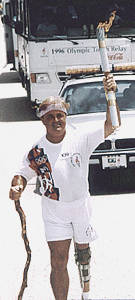 Bill Norkunas carrying the Olypmic Torch
